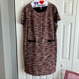 Sheath dress features a textural tweed fabric and decorative pockets.